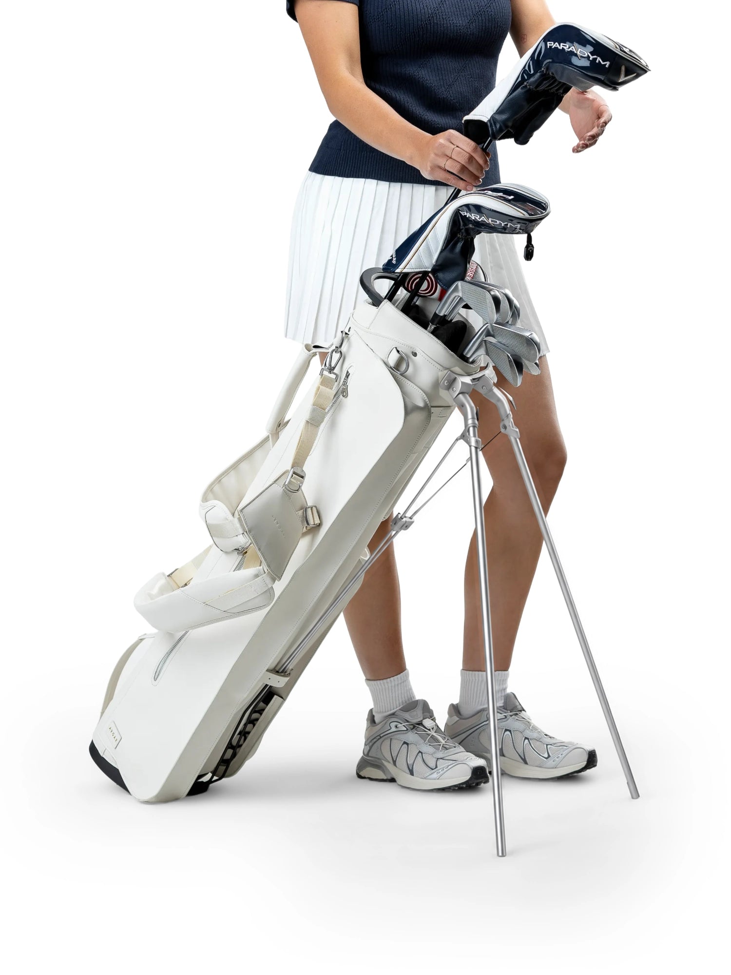 Cream LINKS standing with clubs